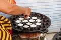 People making sweet and savory grilled coconut rice hotcake Royalty Free Stock Photo