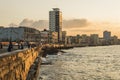 People Malecon boardwalk sunset Havana