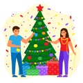 People man and woman decorate green spruce with balls and lightbulbs. Young couple waiting for holiday with gifts. Christmas and