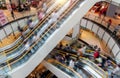 People on fast moving escalators in modern shopping mall Royalty Free Stock Photo