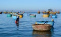 People with many wooden boats on the sea in Phan Thiet, Vietnam