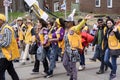 People march along Queen Street East and wave to viewers in the Beaches Easter Parade 2017