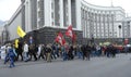 People marching along the street, holding broadsheets demanding legalization of medical marijuana, building of Cabinet