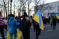 People Marching on a Midtown Manhattan Street in New York City with Ukrainian Flags to Protest the War in Ukraine