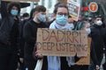 People marching and a young woman holding a sign reading 'Dadirri deep listening'.