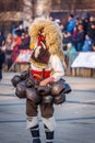 The people with the masks are called Kuker kukeri. Mask from wool and big bells