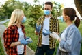 People in masks leisures in park, quarantine Royalty Free Stock Photo