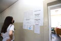 People with masks are using a voting machine in Bulgarian parliamentary elections in Sofia, Bulgaria on July 11, 2021