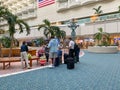 People in masks waiting to go through Orlando International Airport MCO TSA security on a busy day Royalty Free Stock Photo