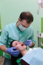 People, medicine, stomatology and health care concept - close up of dentists and assistant with mirror Royalty Free Stock Photo