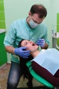 People, medicine, stomatology and health care concept - close up of dentists and assistant with mirror