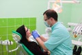 People, medicine, stomatology and health care concept - close up of dentists and assistant with mirror