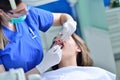 People, medicine, stomatology and health care concept - happy female dentist checking patient girl teeth Royalty Free Stock Photo