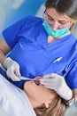 People, medicine, stomatology and health care concept - happy female dentist checking patient girl teeth Royalty Free Stock Photo