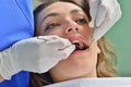 People, medicine, stomatology and health care concept - happy female dentist checking patient girl teeth Royalty Free Stock Photo