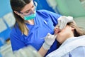 People, medicine, stomatology and health care concept - happy female dentist checking patient girl teeth Royalty Free Stock Photo