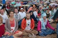 People meditating in a city park