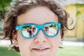 People are mirroring in sunglasses of young teenage boy Royalty Free Stock Photo
