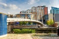 People on a Modern Footbridge in Leeds