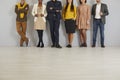 Group of different men and women wearing smart casual clothes standing in office