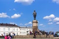 People at the monument to Sergei Kirov in the square