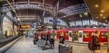 People in the morning wait for the train in the central station