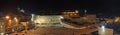 People, mostly soldiers praying at the holiest Jewish site - Western/Wailing wall at night