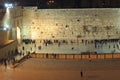 People, mostly soldiers praying at the holiest Jewish site - Western/Wailing wall at night