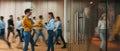 People at motion blur. Concept of working at action. Group of coworkers at open space. Wide image Royalty Free Stock Photo