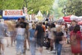 People motion blur walking around at Atlanta Dogwood Festival