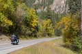 People on a motorbike i nSpearfish Canyon at fall