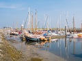 People, motorboats and sailboats in marina of West Frisian island Schiermonnikoog, Netherlands