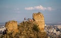 People on the mountain rock near Narikala Fortress before sunset , Tbilisi , Georgia Royalty Free Stock Photo