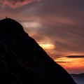 people on mountain summit peak with cross during sunset silhouette dramatic sunset brienzer rothorn switzerland