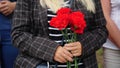 people and mourning concept - woman with white lily flowers and coffin at funeral in church Royalty Free Stock Photo