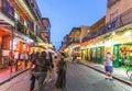 people on the move in the Burbon street at night in the French quarter