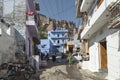 People move on the narrow street in poor area of old city of Khajuraho with slums & houses in Madhya Pradesh state