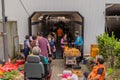 People move through pedestrian underpass at local farmers market Royalty Free Stock Photo