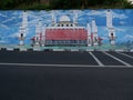 People move through the road with the mural of Semarang's cultural icon located on the Sumbing road.