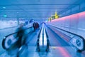 People moving in airport corridor Royalty Free Stock Photo