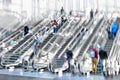 People on moving escalator motion blur Royalty Free Stock Photo
