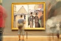 People moving in front of the famous painting Paris street. Rainy day Royalty Free Stock Photo