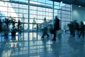 People moving in glass corridor