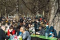 People in Munich enjoy a fantastic sunny day in winter with a fresh Bavarian beer in beer garden