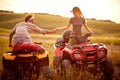 People in the nature.Quad Bike in the mountains.Man and girl driving off-road and enjoying on extreme riding