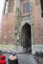 People near arch passage of Cathedral Tower in Utrecht, the Netherlands Royalty Free Stock Photo