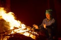 People near campfire in forest Royalty Free Stock Photo