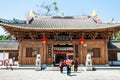 People near doors of Guangxiao Temple in Guangzhou Royalty Free Stock Photo