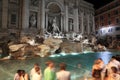 People near fountain Fontana di Trevi at night Royalty Free Stock Photo