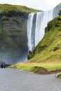 People near Skogafoss waterfall in Iceland Royalty Free Stock Photo